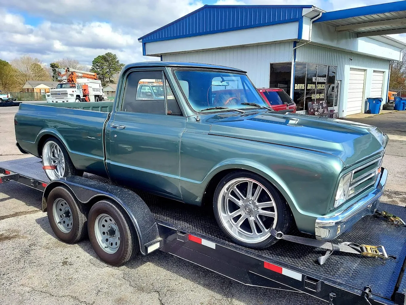 Classic Chevrolet C10 loaded on a transport trailer